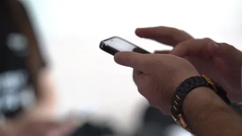 Male's hands are using smartphone. Young man texting on a smartphone device. Video stock 251806641