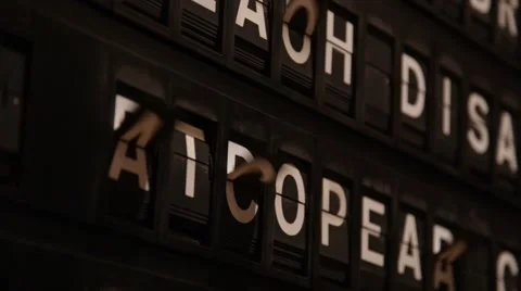 Malfunctioning split-flap arrival departure board changes word 'european' Stock Footage 45594980