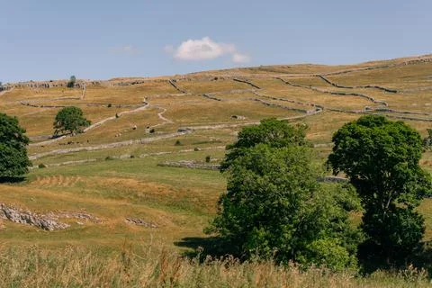 Malham Cove, a dramatic limestone cliff in Yorkshire Dales National Park, N.. Stock Photos