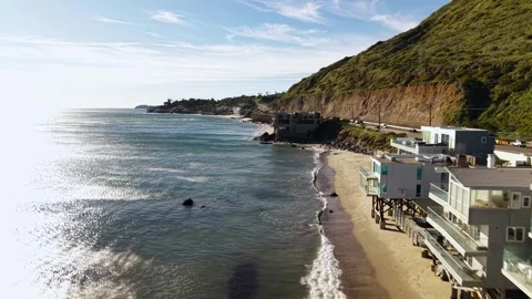 Malibu Beach Fast Drone Flyover of Ocean Shoreline California to PCH North Stock Footage 334939820