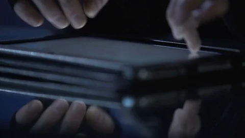 Malicious hacker attacks website from tablet pc, commits cyber extortion crime Video stock 71650156