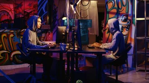 Malicious men hacking computers Stock Photos