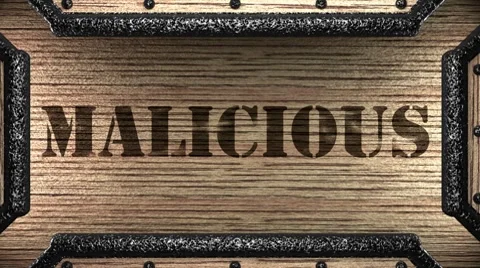 Malicious on wooden stamp Stockbeeldmateriaal 8776594