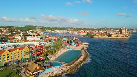 Mall and hotel infinity pool overlooking tropical Caribbean paradise on Stock Footage 260446354