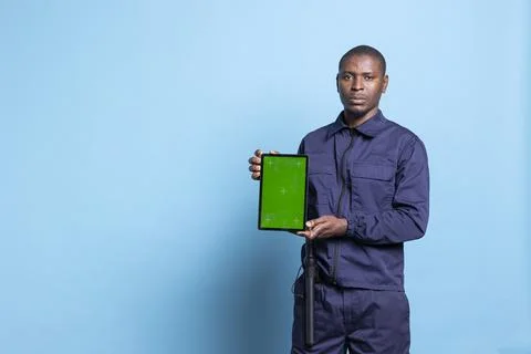 Mall security agent presenting a tablet with isolated mockup screen on camera Stock Photos