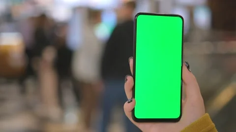 Mall. Use green screen for copy space closeup. Chroma key mock-up on smartphone Stock Footage 251692889