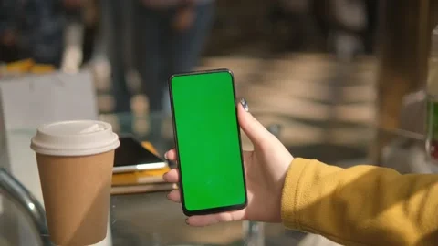 Mall. Use green screen for copy space closeup. Chroma key mock-up on smartphone Stock Footage 252758609
