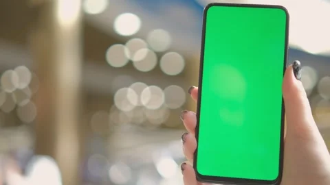 Mall. Use green screen for copy space closeup. Chroma key mock-up on smartphone Stock Footage 277191994