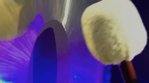 Mallet close-up hitting a big gong with in a dark room. Stock Footage 100561061