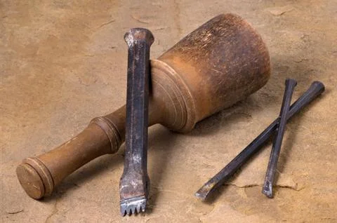 A mallet with three chisels Stock Photos
