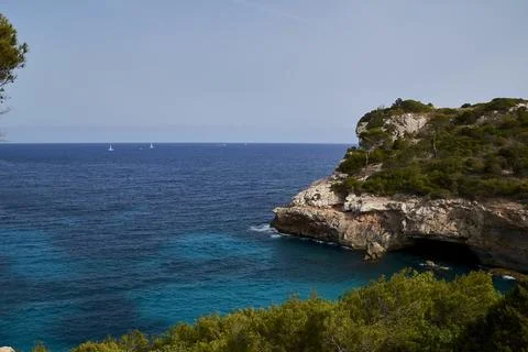 Mallorca beach with cliffs and Mediterranean forest Stock Photos