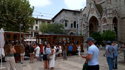 Mallorca, Soller. 07-28-2026. Tram crosses the square Stock Footage 334597033