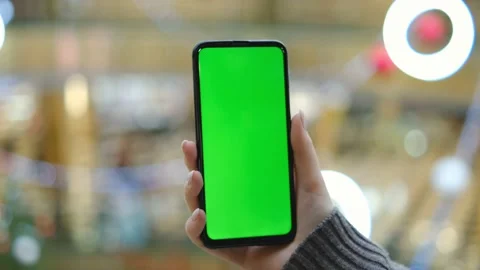 Mall.Use green screen for copy space closeup. Chroma key mock-up on smartphone Stock Footage 197140080