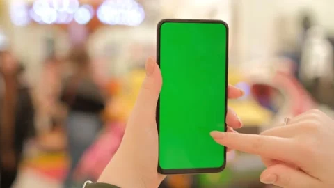 Mall.Use green screen for copy space closeup. Chroma key mock-up on smartphone Stock Footage 234806650