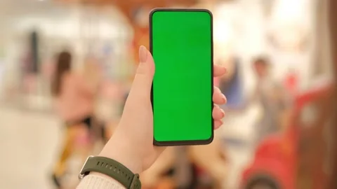Mall.Use green screen for copy space closeup. Chroma key mock-up on smartphone Stock Footage 235165411