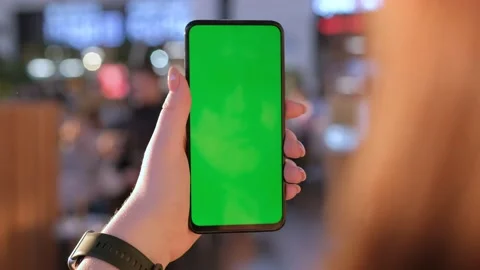 Mall.Use green screen for copy space closeup. Chroma key mock-up on smartphone Stock Footage 236190124