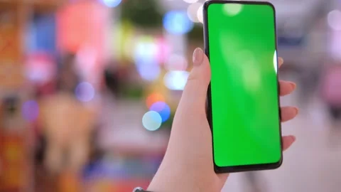 Mall.Use green screen for copy space closeup. children ride an attraction in the Stock Footage 236190378