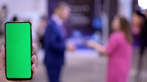 Mall.Use green screen for copy space closeup. Chroma key mock-up on smartphone Stock Footage 249338241
