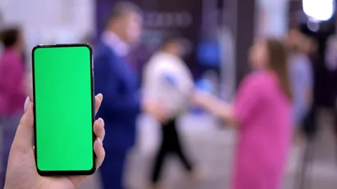 Mall.Use green screen for copy space closeup. Chroma key mock-up on smartphone Stock Footage 250519091