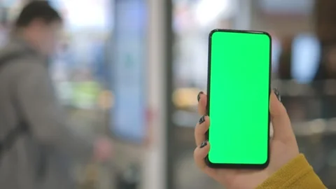 Mall.Use green screen for copy space closeup. Chroma key mock-up on smartphone Stock Footage 252386151