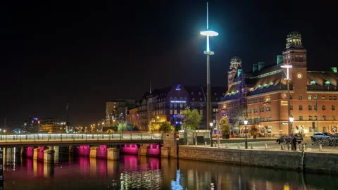 Malmo night light illumination with water reflection cityscape traffic timelapse Stock Footage 233663599