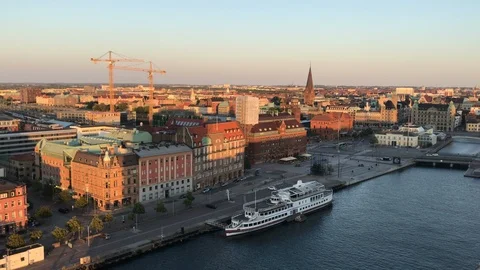 Malmö skyline and centralstation located next to a canal Stock Footage 93356476