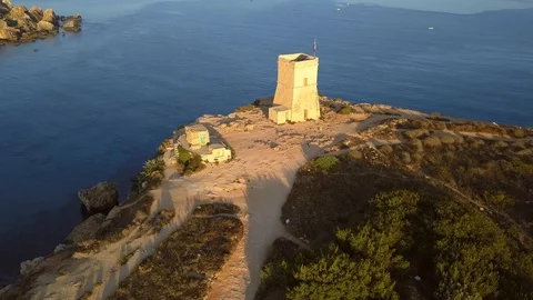 Malta - 4K flying around full circle of Ghajn Tuffieha Watch Tower Stock Footage 91786431