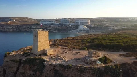 Malta - 4K flying next to Ghajn Tuffieha Watch Tower on a summer morning Stock Footage 91786482