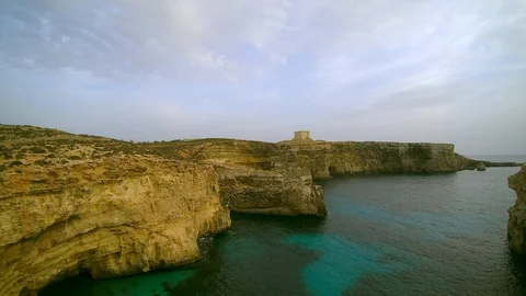 Malta  Comino cliffs and ocean drone aerial Stock Footage 107609617