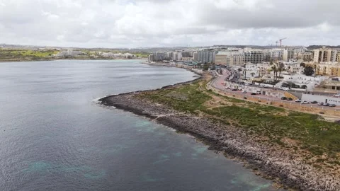 Malta, St Paul Bay Panoramic Aerial Rising Orbit Cloudy Sky Stock-Footage 333373404