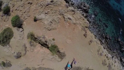 Malta. Two guys stand on the mountain in the sea Stock Footage 72590273