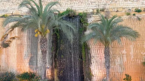 Malta Waterfall at Evening Lights Stone Wall Feature Aerial Vídeos de archivo 333828030