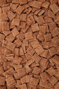 Malted shredded wheat biscuits background Stock Photos
