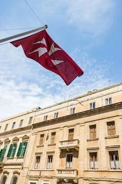 Maltese cross on a flag Stock Photos