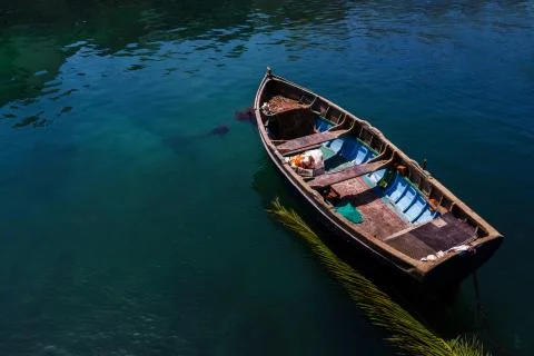 Maltese fisherman boad on greeny blue water Stock Photos