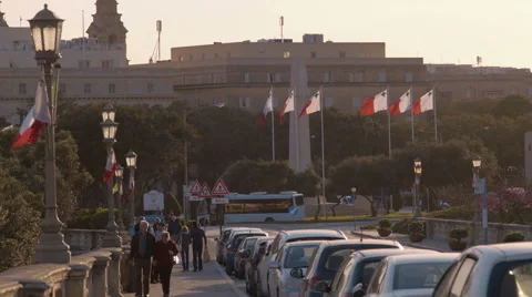 Maltese flags during sunset in Valletta Malta Stock Footage 65387577