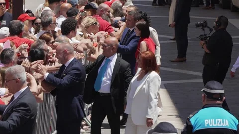 Maltese ministers stand with officials at a post-election event in Valletta. Stock Footage 336489157