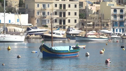 Maltese traditional boat in the Grand Harbour Stock Footage