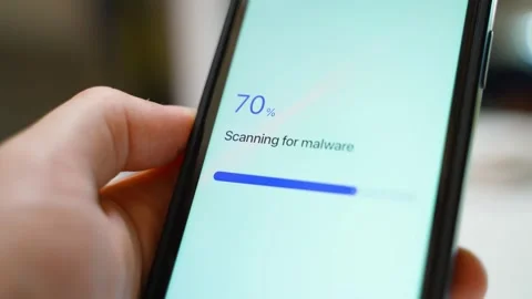 Malware scan stuck at 70 percent on a smartphone in hand. Frozen loading Stock Footage 342940319
