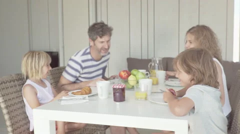 Mama caress his son during family breakfast Video stock 65171652