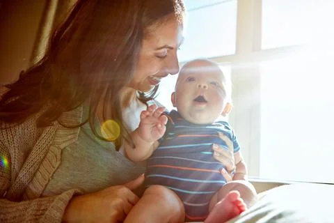 Mamas favourite little guy. a mother bonding with her baby boy at home. Stock Photos