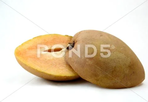Mamey zapote sliced in half Stock Photos