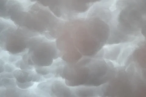 Mammatus clouds create a dramatic and textured sky with their unique bulbous  Stock Photos