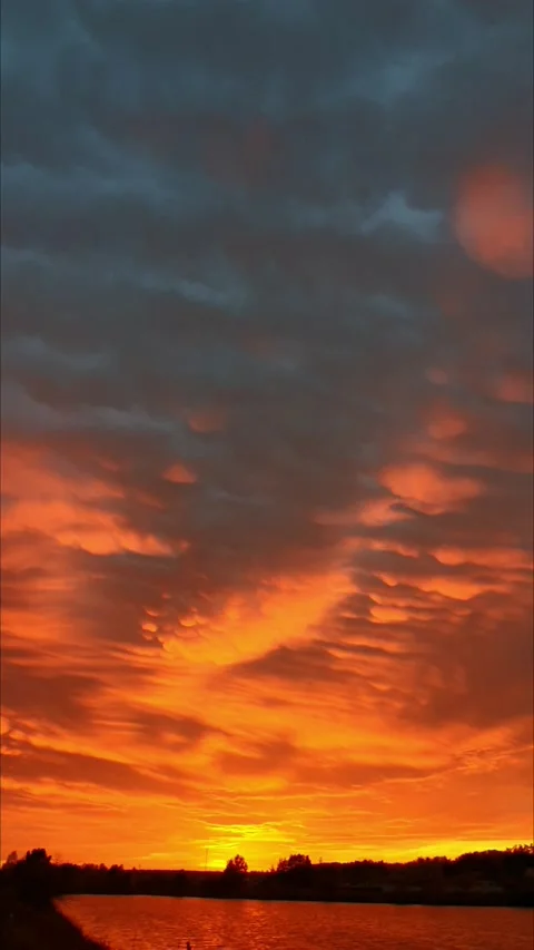 Mammatus clouds in the light of the setting sun Stock Footage 201962645