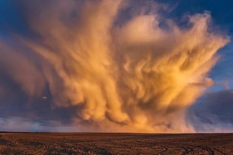 Mammatus clouds at sunset, dramatic storm clouds Stock Photos