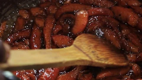 Mammee apple jam boiling in a pan Stock Footage 154857507