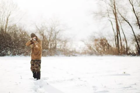 Man with a 12-gauge shotguns. Stock Photos