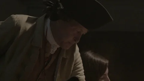 Man in 1700s Tavern reading document - Declaration of Independence to a group Stock Footage 81225210