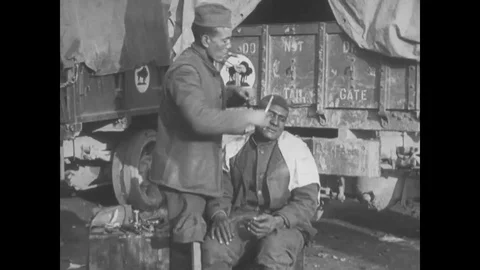 Man of 317 Supply Train gets his hair cut at Mobile Ordnance Repair Shop - 1918 Stock Footage 99782287