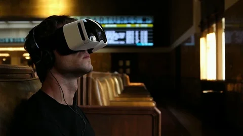 Man in 360 VR Helmet Virtual Reality Glasses relaxing while traveling Stock Footage 87487481